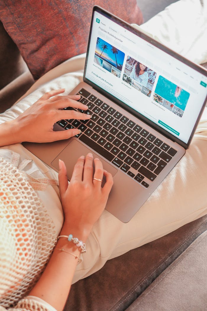 about-us A woman comfortably working on a laptop from home, showcasing remote work lifestyle.